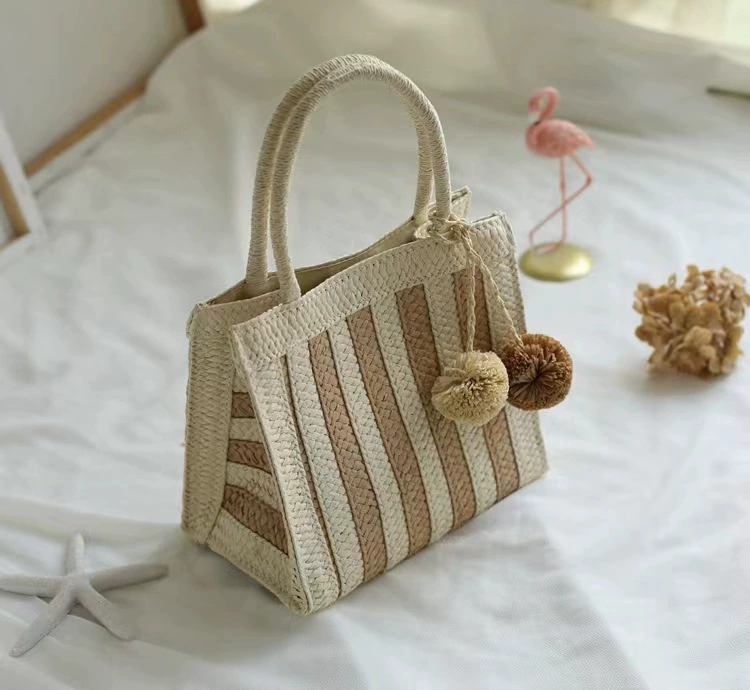 Bolso de mano de paja a rayas tejido con pompones, bolso de mano vertical mediano con diseño abierto estilo arte chino vintage para uso diario