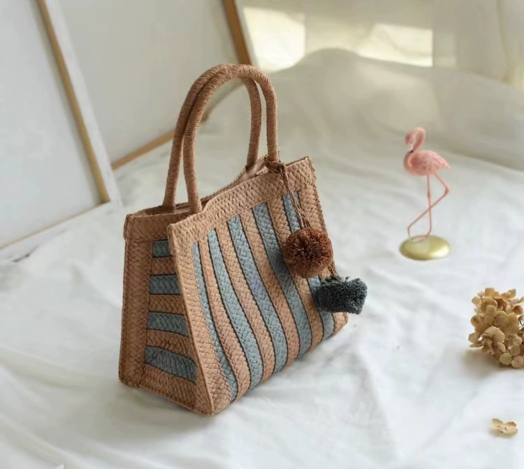 Bolso de mano de paja a rayas tejido con pompones, bolso de mano vertical mediano con diseño abierto estilo arte chino vintage para uso diario